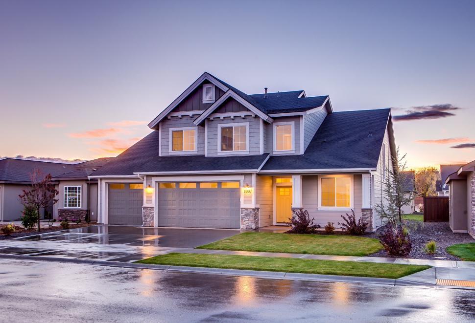 Beautiful Airdrie home at dusk with double garage